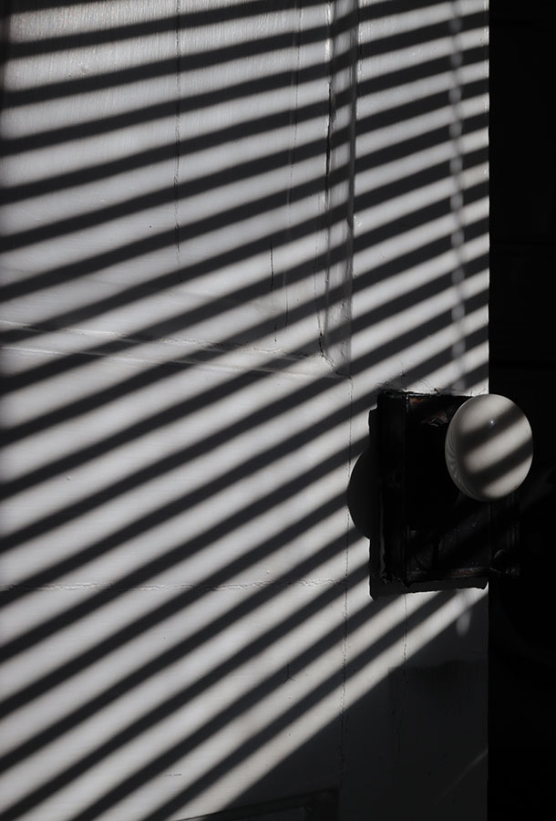 Venetion Blind Shadows on Antique Door